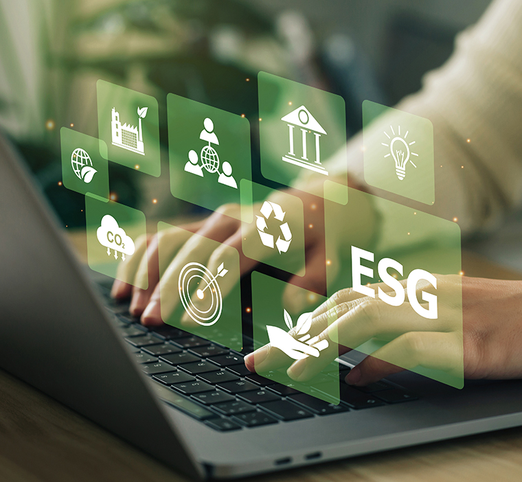 Image of person at computer with icons related to sustainability